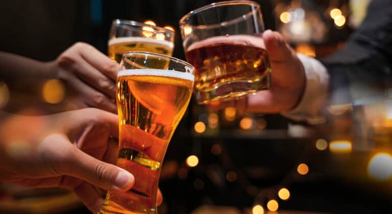 People raising a glass of different alcohol