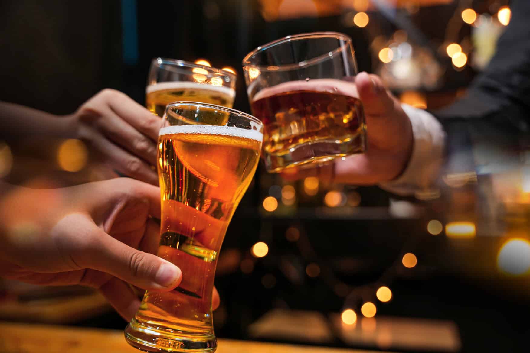 People raising a glass of different alcohol